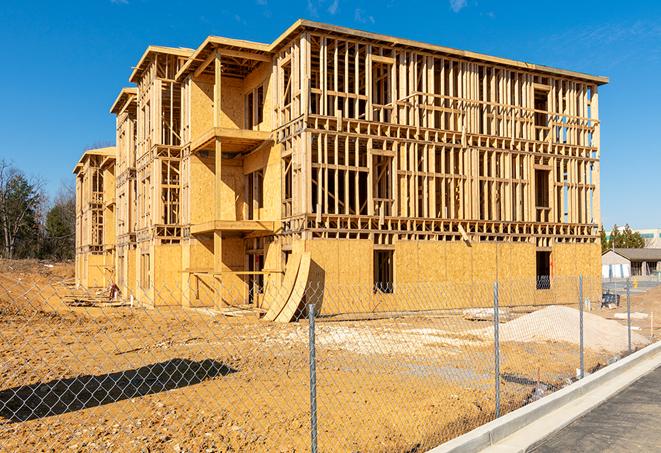 a temporary chain link fence in front of a building under construction, ensuring public safety in Cupertino, CA